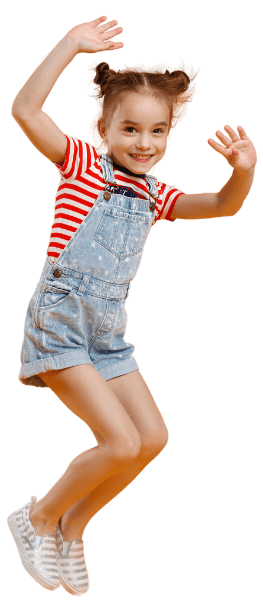 girl with red striped shirt and overalls jumping in the air