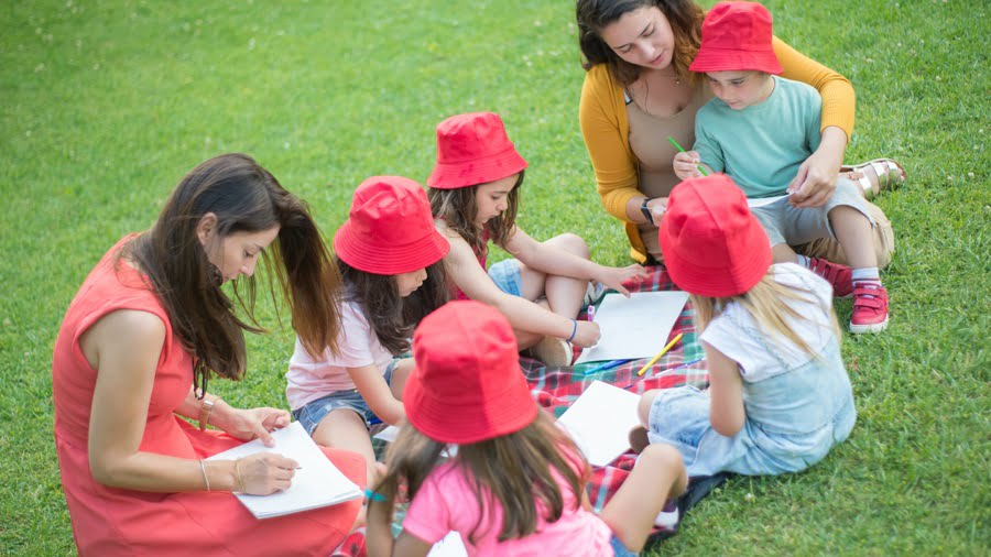Kids colouring in a park